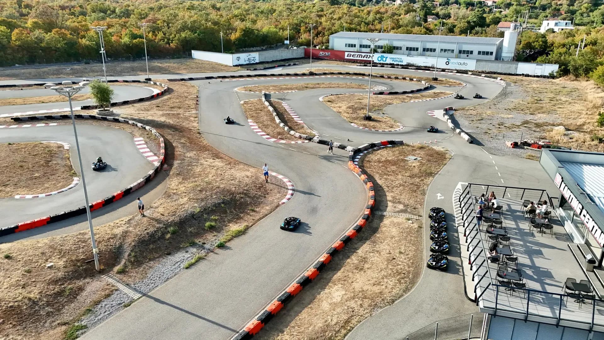 Karts racing on the track, filmed by drone