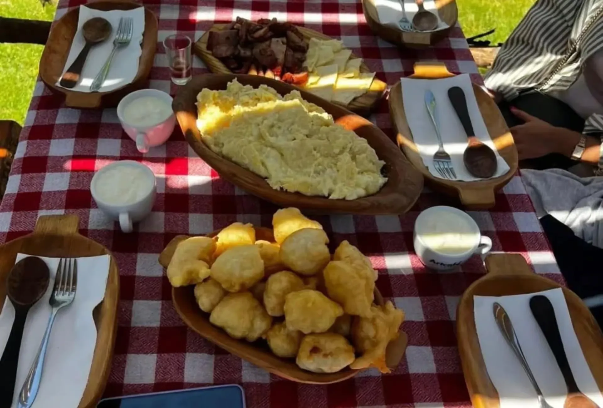 Traditional Montenegrin lunch with cheese, kačamak and priganice