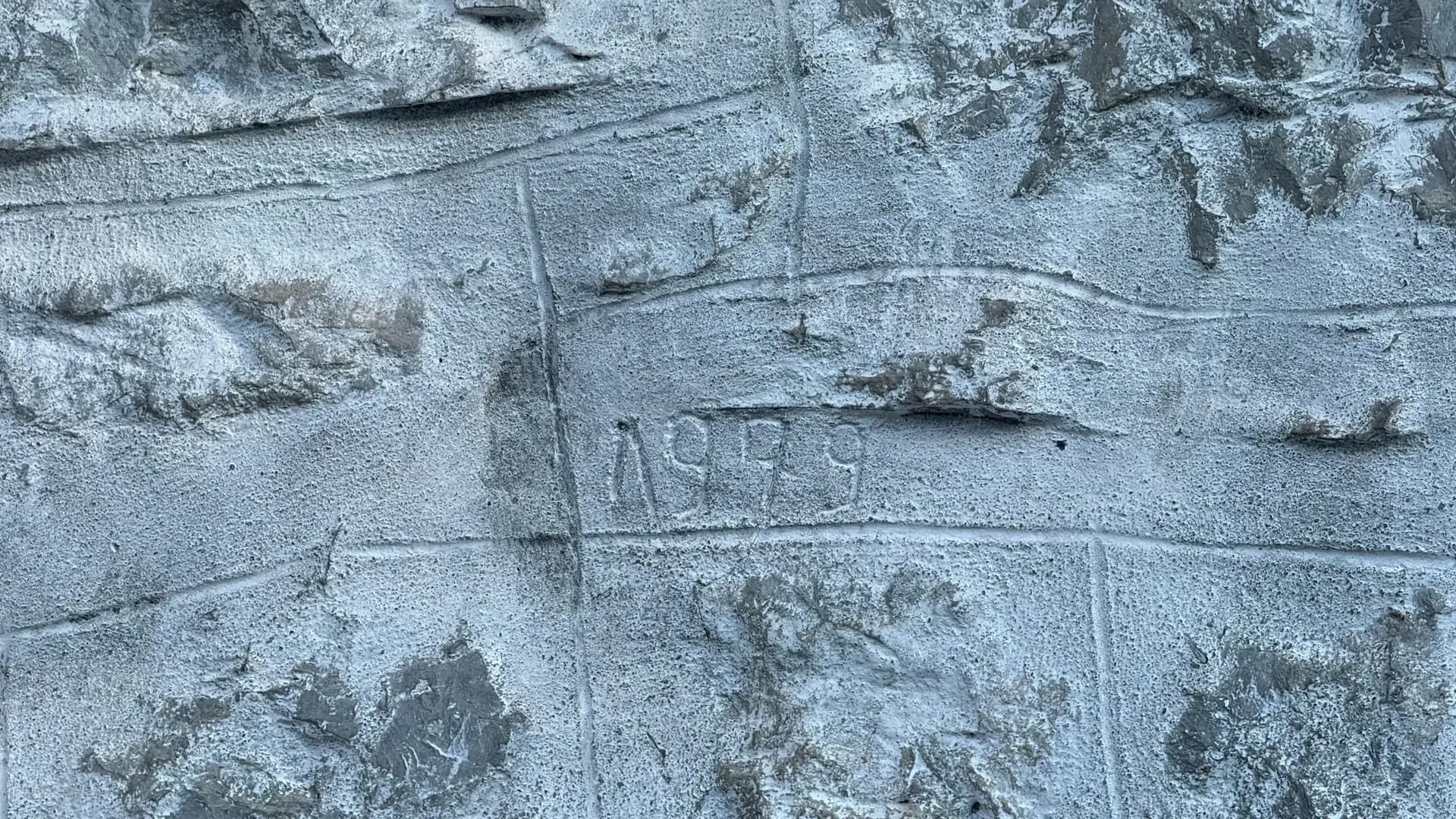 The year 1979 carved into the stone wall of the house