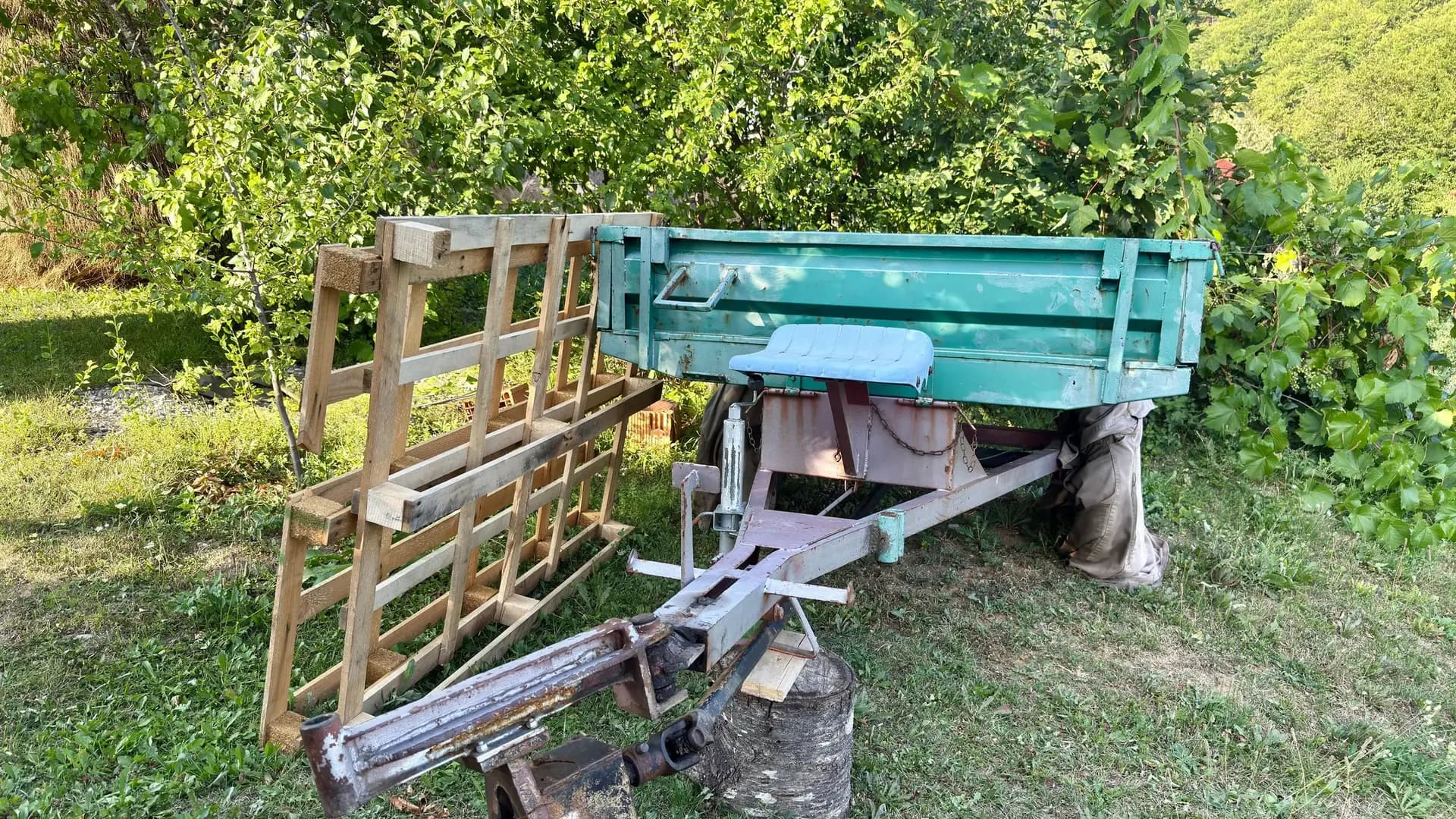 Tractor and trailer in a village orchard
